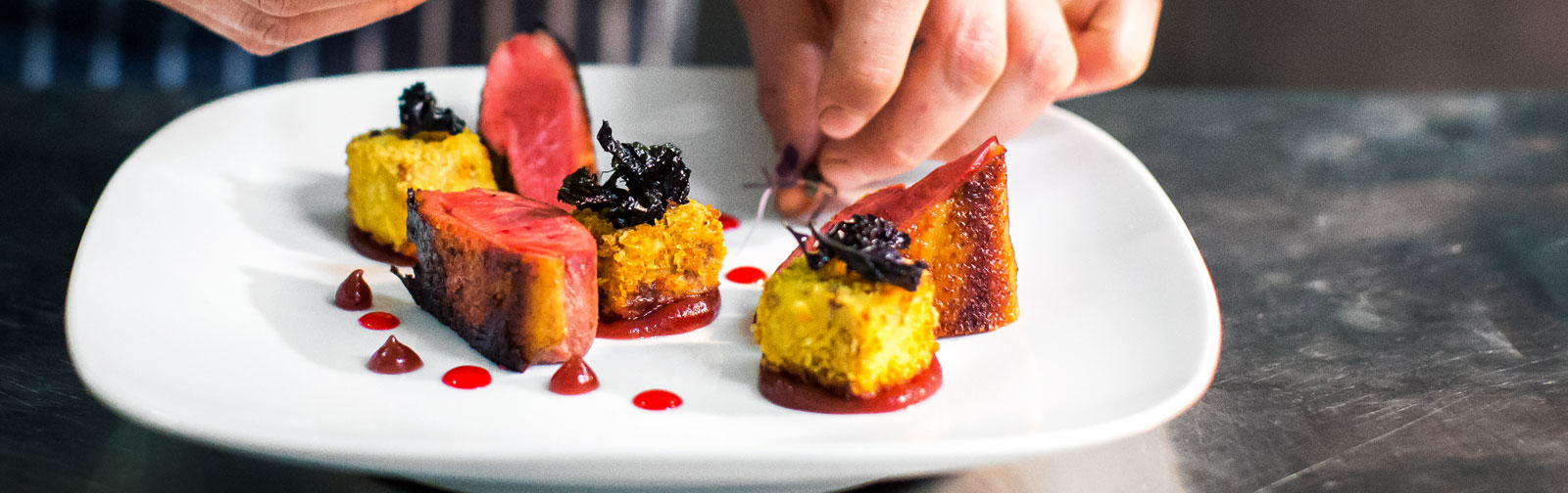 Plate of assorted food with chef in view